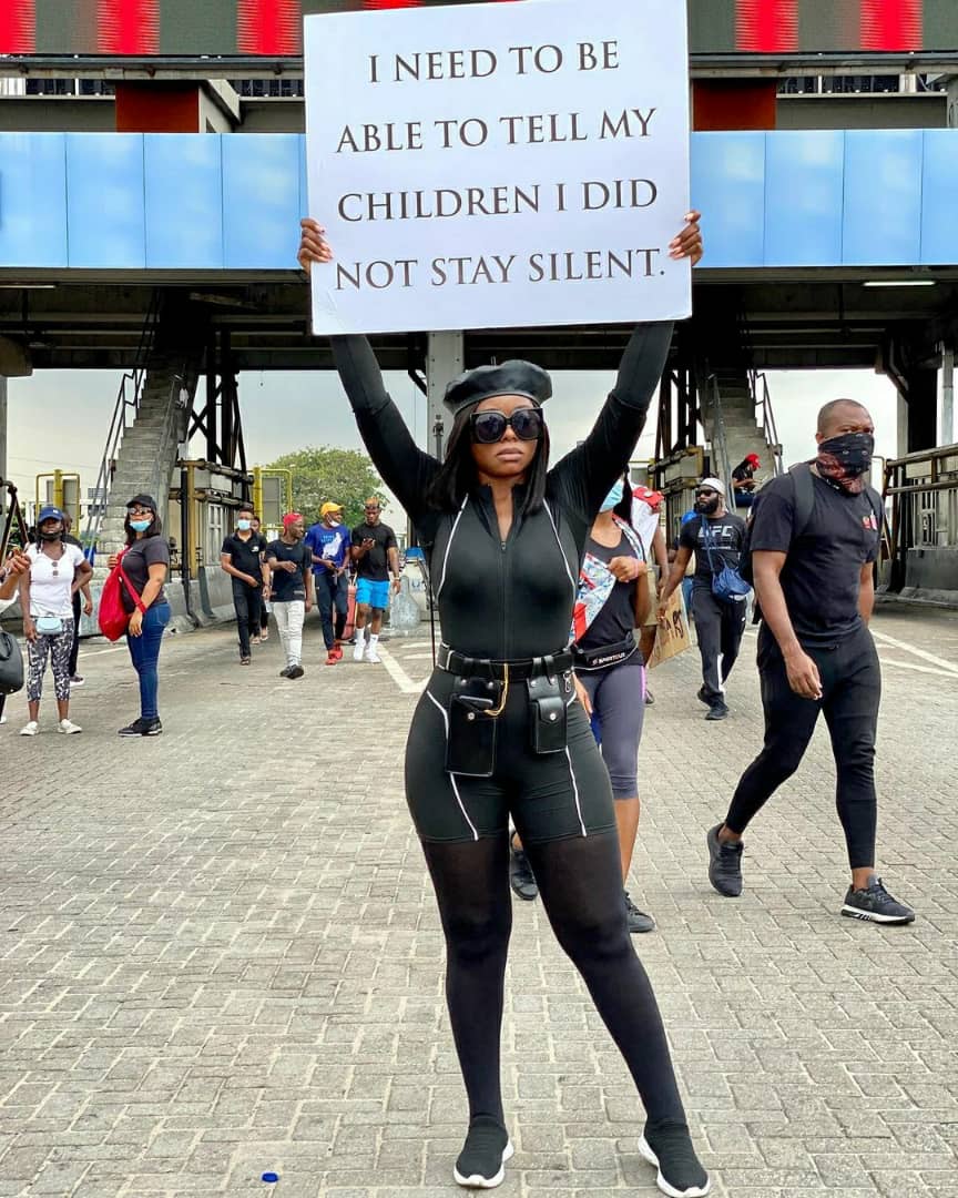 ariyiike dimples at the end sars protest in lagos nigeria wearing an all black outfit